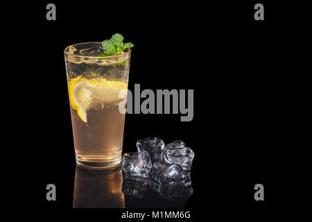 alcohol cocktail with lemon and mint on a black background alcohol cocktail with lemon and mint on a black background