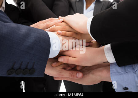 Close-up Photo Of Businesspeople Stacking Hands Together Stock Photo