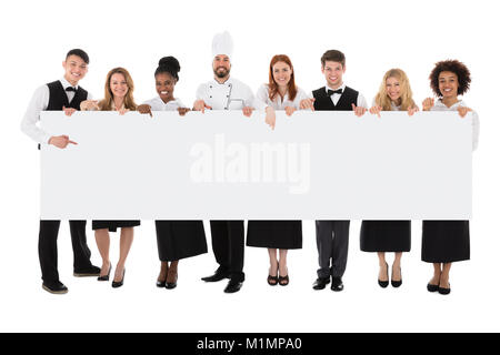 Happy Multiracial Restaurant Staff Holding Long Blank Banner Stock Photo
