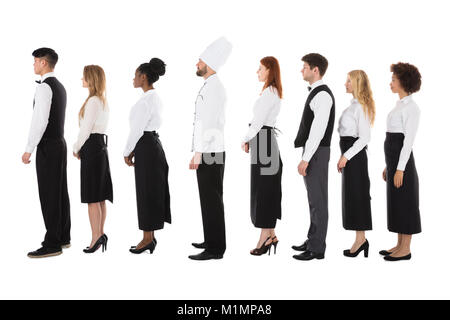 Multiracial Restaurant Staff Standing In Row Over White Background Stock Photo