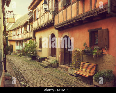 Winding street in Eguisheim, north-eastern France.  Toned image Stock Photo