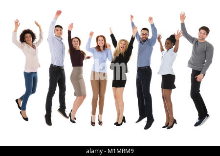 Portrait Of Excited College Students Raising Their Arms Over White Background Stock Photo