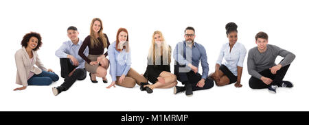 Portrait Of Happy Multiracial College Students Sitting On White Background Stock Photo