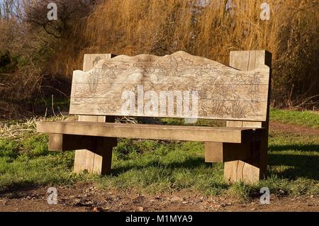 Bench carved with an illustrated map of the River Ver in St Albans Stock Photo