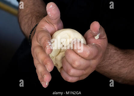Pizza dough balls making Stock Photo