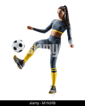 Football soccer player in action. Photo of sporty woman in sportswear isolated white background. Dynamic movement. Stock Photo