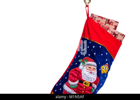 Traditional Christmas or Xmas stocking, filled with gift wrapped presents or gifts. Stock Photo
