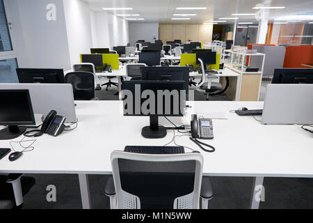 Workstation in an empty open plan office Stock Photo