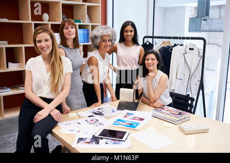 All female creative team smiling to camera in an office Stock Photo