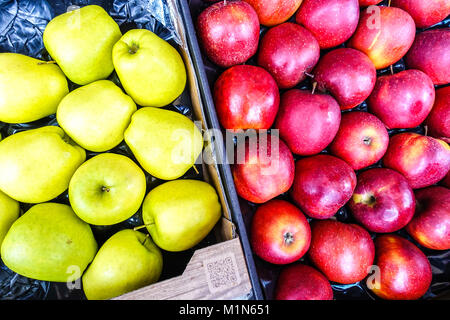 Fresh stacked apples at crate Stock Photo