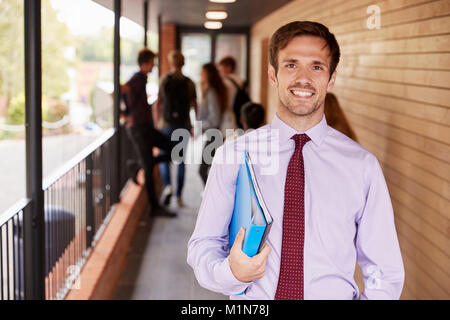 Portrait Of Teacher Standing Outside School Building Stock Photo