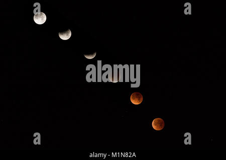 A composite image of the phases of the Super Blue Blood Moon as seen from Manhattan Beach, California on January 31, 2018. Stock Photo