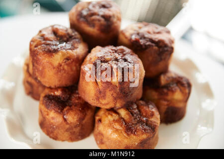 Display Of Freshly Baked Cinnamon Buns In Coffee Shop Stock Photo