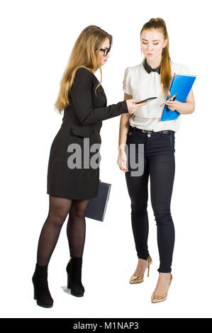 Beauty blonde businesswomen holding documents and interacting. Concept of teamwork. Stock Photo