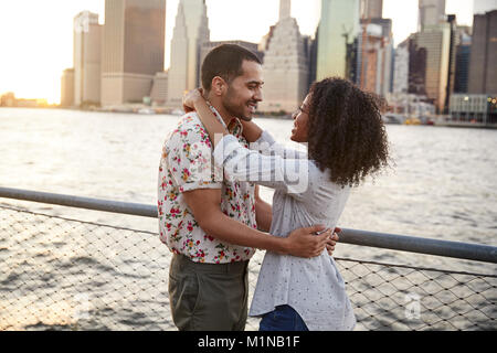 Romantic Young Couple With Manhattan Skyline In Background Stock Photo