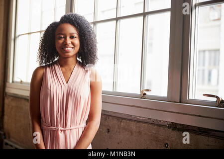 Smart young black businesswoman smiling to camera Stock Photo
