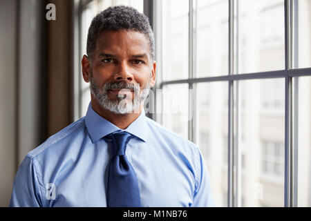Middle aged black businessman looking to camera Stock Photo