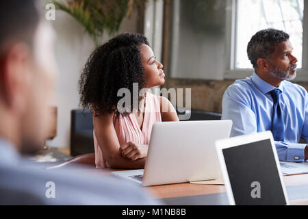 Close up of business colleagues at a boardroom meeting Stock Photo