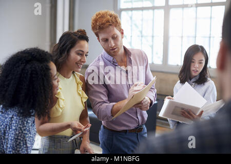 Young creatives discussing brainstorm ideas, close up Stock Photo