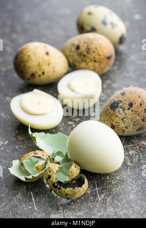 Boiled guail eggs on old kitchen table. Stock Photo