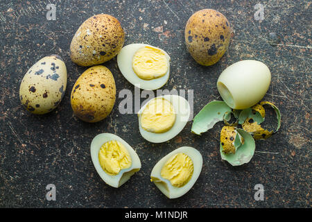 Boiled guail eggs on old kitchen table. Stock Photo