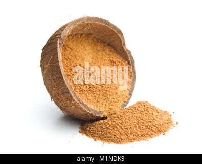 Sweet coconut sugar in coconut shell isolated on white background. Stock Photo