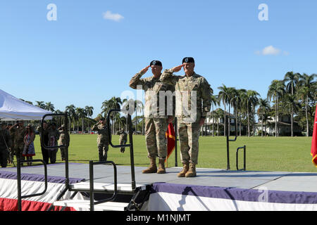 Gen. Robert B. Brown, Commanding General of U.S. Army Pacific and Maj. Gen. Charles A. Flynn, outgoing Deputy Commanding General-South, salute during a Flying V ceremony Jan. 29 at historic Palm Circle on Fort Shafter, Hawaii. During the ceremony, Soldiers, Family and friends bid farewell to Flynn, who had served as the USARPAC DCG-South Since Aug. of 2016. Stock Photo