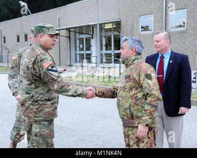 (From left) U.S. Army Lt. Col. Ismael B. Natividad, Training Support Activity Europe (TSAE) Director, greets Italian Army Col. Marco Becherini, Folgore (ABN) Brigade Training Center Commander and James V. Matheson, Regional Training Support Division South Chief, 7th Army Training Command, during the TSAE Director visit at Lustrissimi Training Area, Livorno, Italy, Jan 30, 2018.(
