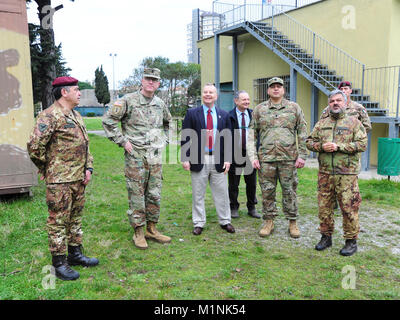 (From left) 1 Mar LGT Giuseppe Tringale, Folgore (ABN) Brigade Headquarters Plans Noncommissioned Officer, Sgt. Maj. Anthony R. Valdez, 7 Army Training Command G-3 Sergeant Major, James V. Matheson, Chief Regional Training Support Division South, 7th Army Training Command, Ivano Trevisanutto, Chief Training Support Center Italy, 7th Army Training Command, Lt. Col. Ismael B. Natividad, Training Support Activity Europe (TSAE) Director, Col. Marco Becherini, Folgore (ABN) Brigade Training Center Commander, visit Lustrissimi Training Area, Livorno, Italy, Jan 30, 2018.(