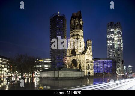 The Kaiser Wilhelm Memorial Church with the Breitscheidplatz  in Berlin, Germany,  23.01.2018. The upper West Side Tower (M) is in the background. (long time exposure) | usage worldwide Stock Photo