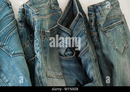 Blue jeans on a hanger, business fashion concept Stock Photo