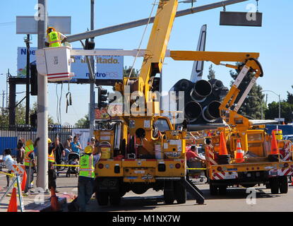 Los Angeles, CA - Oct. 13, 2012: City workers reinstall traffic lights removed to transport NASA's retired space shuttle, Endeavour, to its final home. Stock Photo