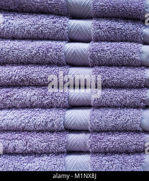 Purlpe cotton towels display in department store. Stock Photo