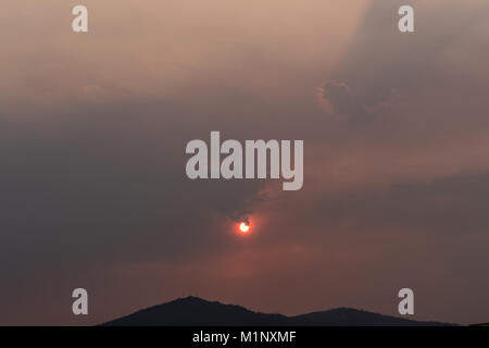 red sun in the lands of Galicia, spain, due to the smoke of the fires that ravaged our land a few months ago, looking like the end of the world Stock Photo