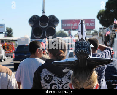 Los Angeles, CA - Oct. 13, 2012: A girl wears a space shuttle shaped hat as the NASA Endeavour shuttle is moved down city streets to its final home. Stock Photo