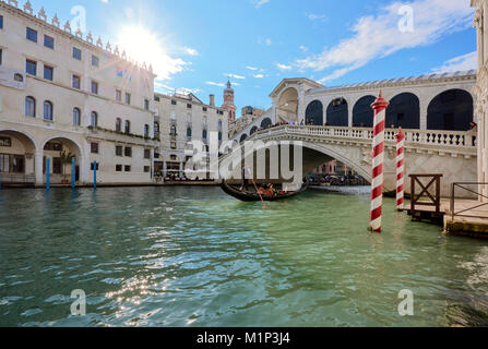 A gondolier rowing under Rialto Bridge in Venice, UNESCO World Heritage Site, Veneto, Italy, Europe Stock Photo