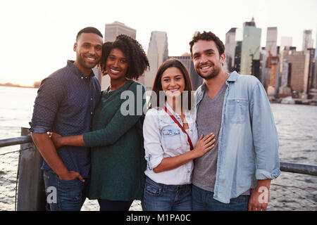 Young couple standing on quayside, front view Stock Photo