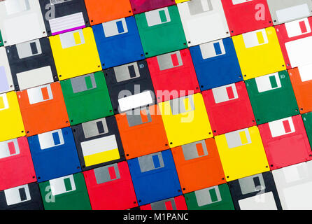 Horizontal close-up shot of a group of multicolored plastic diskettes angled left. Stock Photo