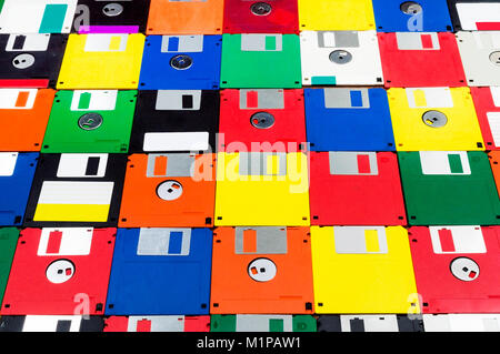 Horizontal close-up angled shot of a group of multicolored plastic diskettes.  Some fronts some backs. Stock Photo