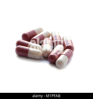 Closed up medicine Pink capsule isolated on white background Stock Photo