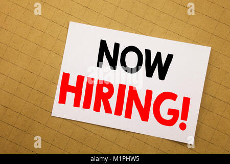 Conceptual hand writing text caption inspiration showing Now Hiring. Business concept for Hire Recruitment Written on sticky note yellow background Stock Photo