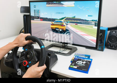 Playing racing video game at home Stock Photo