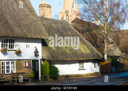 Traditional Village Pub Axe And Compass With Thatched Roof At ...