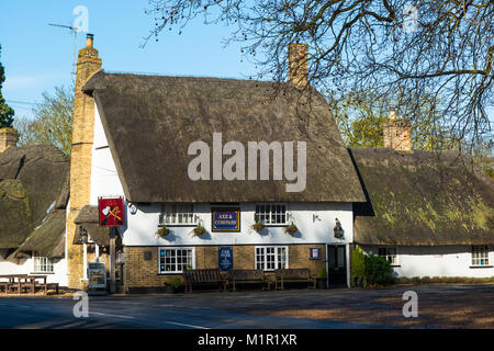 Traditional Village Pub Axe And Compass With Thatched Roof At ...