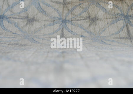 Soft focus of white and blue blanket with geometric pattern textile background Stock Photo