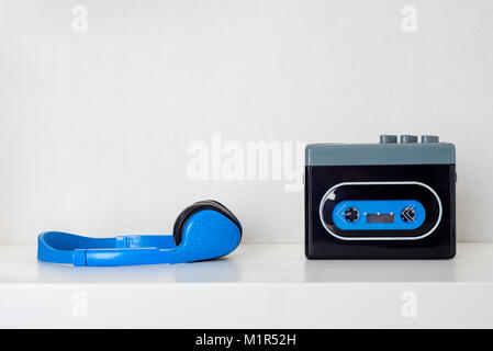Retro cassette player and headphones on the shelf