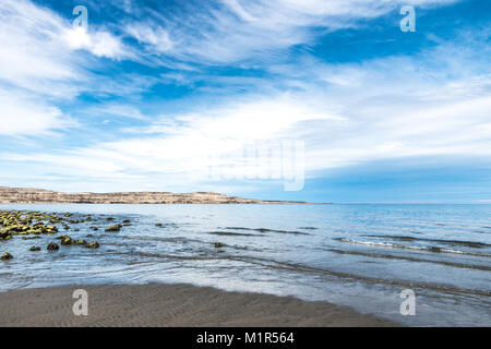 Puerto Madryn beach, sun, waves and sand, beautiful day Stock Photo