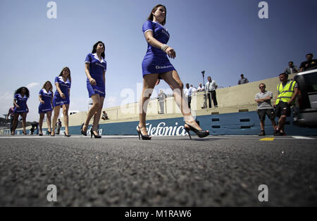 Sao Paulo, Brazil. 03rd Nov, 2010. Grid girls walk along the race track during an instruction for the Brazilian Grand Prix in Sao Paulo, Brazil, 03 November 2010. The Formula One Brazilian Grand Prix is held at the Autodromo Jose Carlos Pace in Interlagos on 07 November 2010. Credit: Jan Woitas | usage worldwide/dpa/Alamy Live News Stock Photo