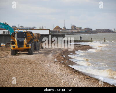 Sheerness, Kent, UK. 1st Feb, 2018. UK Weather: a young woman takes a surge tide selfie as the Neptune Jetty is covered by water during today's surge tide. Sunny spells but with a strong and cold westerly wind. Credit: James Bell/Alamy Live News Stock Photo