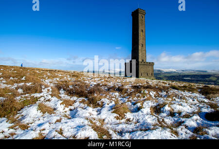 Holcombe Hill, Lancashire, UK. 1st February, 2018. Beautiful cold, crisp and sunny weather on the first day of February at Holcombe Hill, near Bury, Lancashire, as a dusting of snow covers the hill top near the Peel Monument. Built in 1852 this well known Bury landmark was erected in tribute to one of Bury's most famous sons, Sir Robert Peel; founder of the Police force and Prime Minister 1841-1846. Picture by Paul Heyes, Thursday February 01, 2018. Credit: Paul Heyes/Alamy Live News Stock Photo